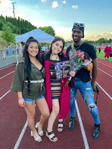 McKenzie Shaffer, center, 1st Ernie Davis Fashion Club student graduate since 2021 relaunc