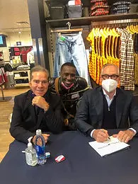 Jordan Brooks aka lacedbylacroix with fashion designers Andy, left, and Tommy Hilfiger.jpg